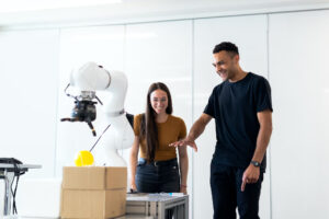 a man and a woman inspecting a machine